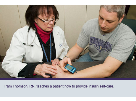 Pam Thomson, RN, teaches a patient how to provide insulin self-care.